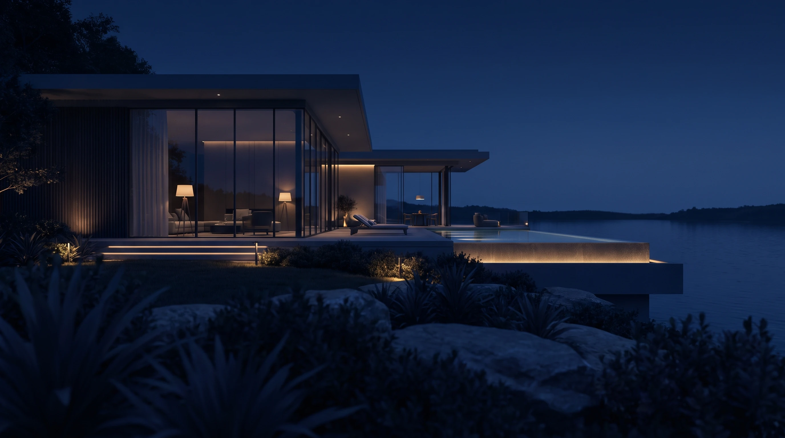 Villa de lujo al anochecer con piscina y luces cálidas